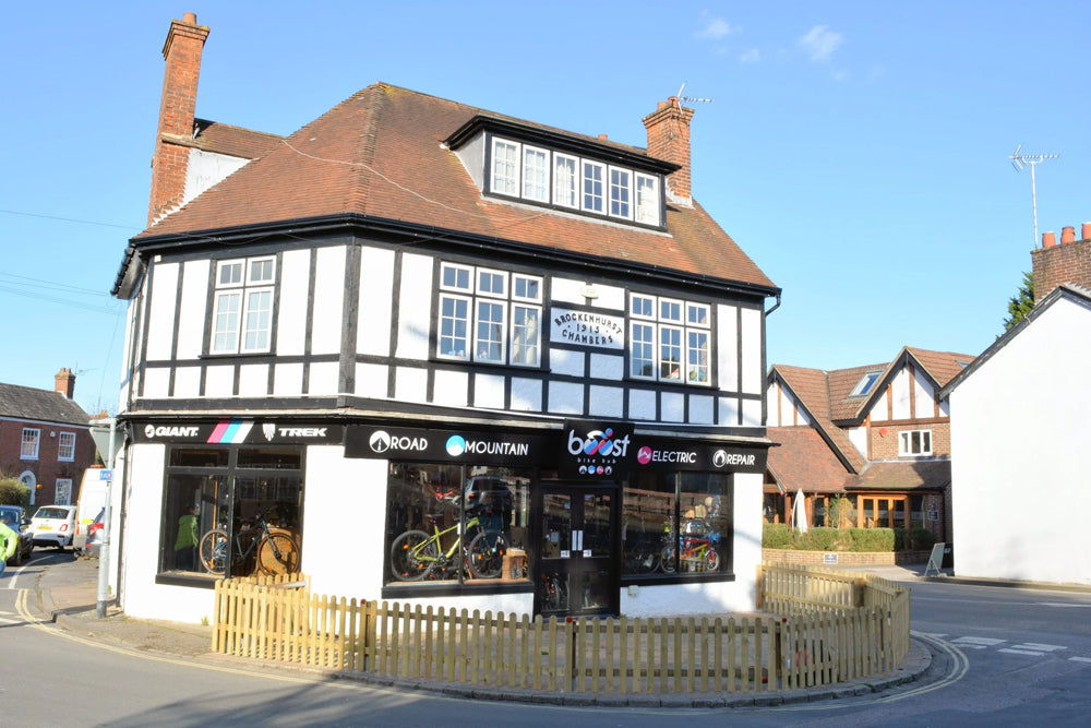 Two-story building with a bicycle shop on a residential street
