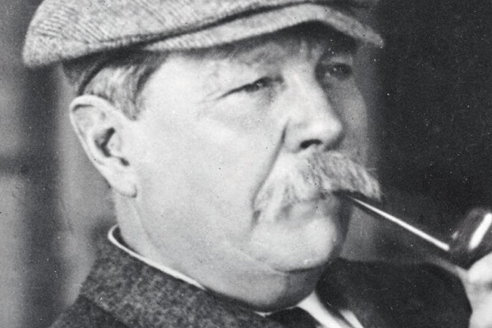 Black and white portrait of a man with a pipe and cap