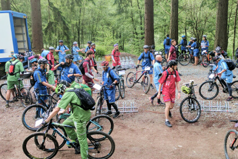 Group of cyclists in a forest setting