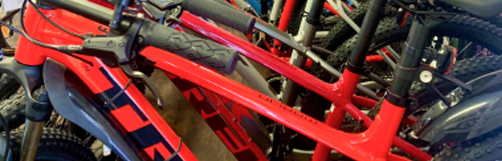 Close-up of a red bicycle frame with visible branding
