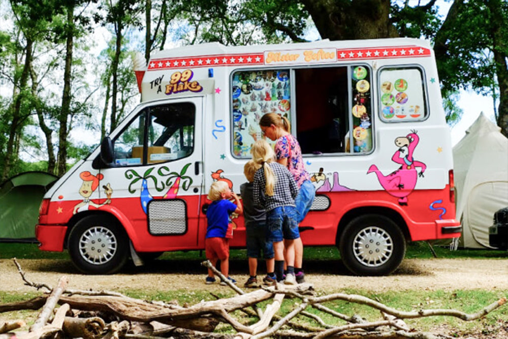 Image of a mother and three children buying ice cream at an ice cream van