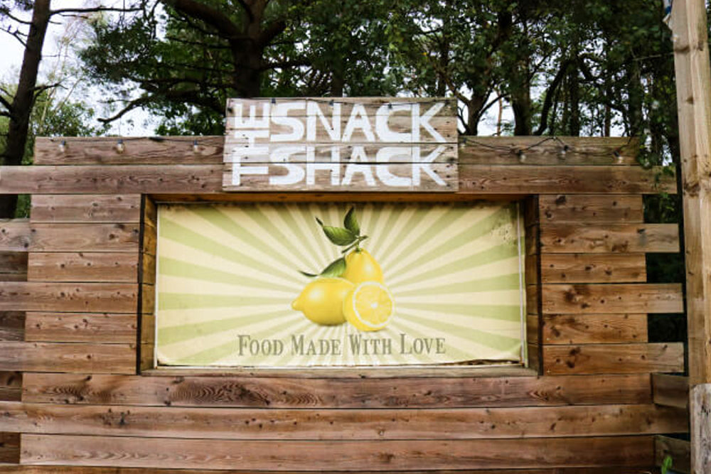 Image of a wooden building with the sign 'the snack shack; and some lemons